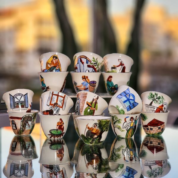 Collection of hand-painted Arabic coffee cups with traditional Lebanese designs, crafted with high-quality French materials, heat-resistant and non-toxic.